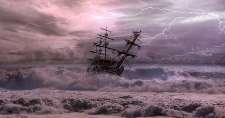 Garden poster Schip Sailing old ship in storm sea against dramatic sunset