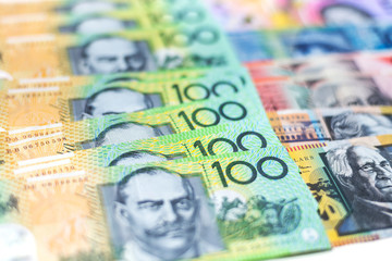 Australian 100 dollar notes closeup with white background.