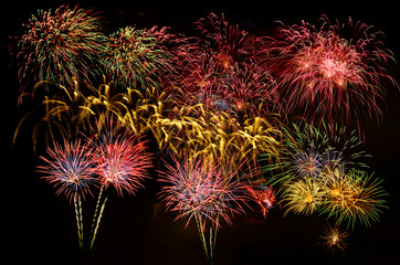 Colorful fireworks celebration and the midnight sky background.