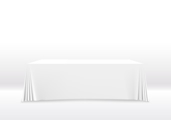 Table with tablecloth art banner, white background.