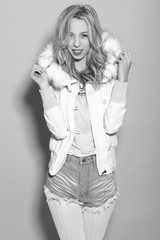 Fototapeta premium young beautiful girl in a white jacket