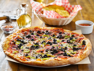 tasty supreme pizza with olives peppers onions and sausage