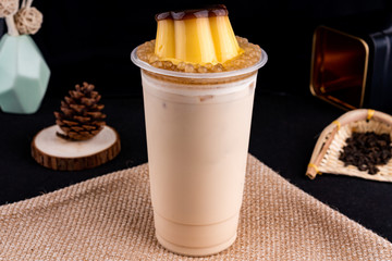Fresh pressed frozen tea beverage in black background