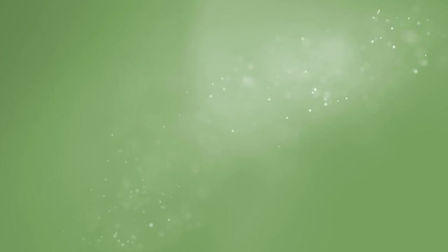 Abstract tiny white particles moving on green background. Shiny floating bokeh particles. Soft snowing background animation.