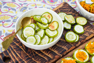 Baked roasted zucchini circles on board with carrot stuffing. Vegan lunch, vegetarian dinner, healthy food.