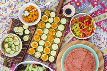 Baked roasted zucchini circles on board with carrot stuffing. Vegan lunch, vegetarian dinner, healthy food.