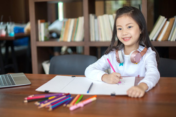 Asia little student girl studying and reading book at school - education and school concept