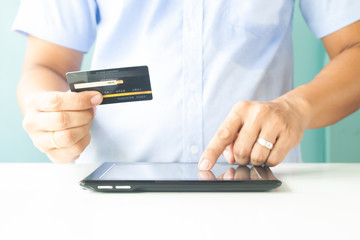 Man hands using tablet and credit card. Online payment. E-business, online banking