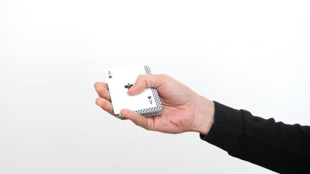 Male Hand Making Tricks with Cards on White Background