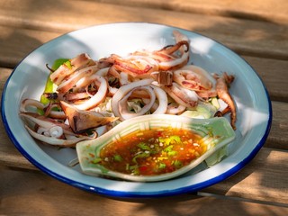 Slice of Grilled squid with Thai seafood sauce 