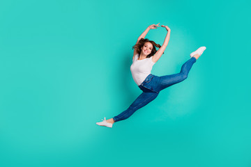 Full length body size view of her she nice-looking attractive lovely cheerful cheery sportive slim fit thin slender wavy-haired lady practicing hobby isolated on bright vivid shine blue background