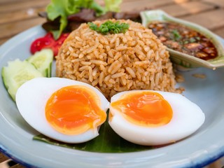 chili paste fried rice with grill pork with Fish sauce with chili. Fish sauce with red chili and Boiled egg