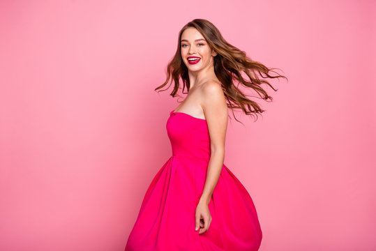 Close up side profile photo beautiful she her dancing prom queen lady wind flight blow air skirt plump allure rose lips graduation party wear cute shiny colorful dress isolated pink bright background