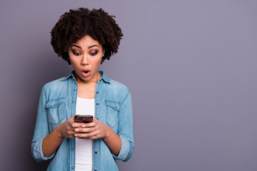 Portrait of astonished funny funky lady hold hand use user gadget look news feed impressed horrible...