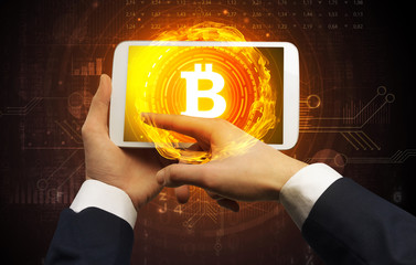 Elegant hand touching tablet with cryptocurrency concept
