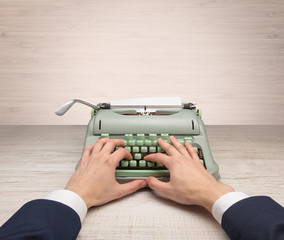 First person perspective elegant hand writing on an oldschool typewriter with copyspace
