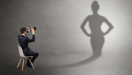 Rich businessman staying and offering stuffs to a pretty shadow woman
