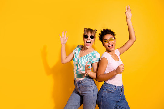Close up photo beautiful she her lady party crazy guys hands arms raised up modern motion different nationalities wear sun specs casual white striped t-shirt clothes isolated yellow bright background