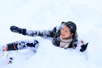 Fototapeta na wymiar woman enjoy playing in the snow,Japan