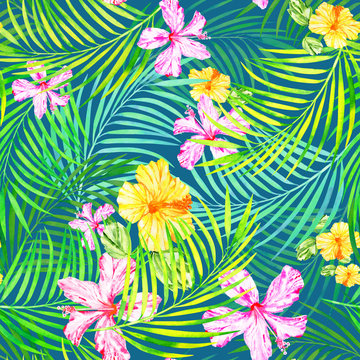 seamless floral tropical pattern of hibiscus flowers and palm leaves on a cool blue background