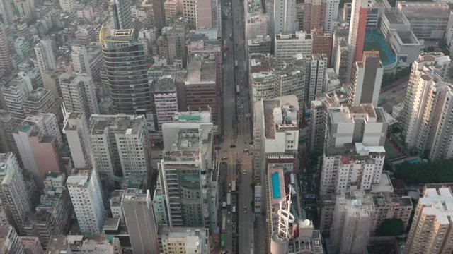 Aerial view of Hong Kong city scape in Kowloon. Street with traffic. 
