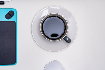 White desktop computer keyboard and painting tool coffee combination