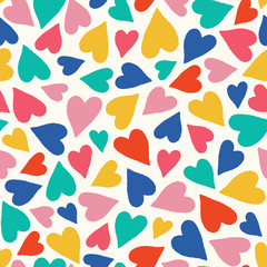Hand drawn colorful tossed heart pattern. A pretty vector seamless repeat pattern ideal for valentines fabric, scrap booking and stationery projects projects.