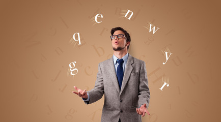 Young student juggle with letters 
