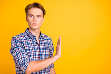 Portrait of his he nice attractive guy wearing checked shirt refusing bad offer isolated over...