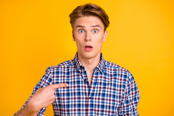 Close-up portrait of his he nice-looking attractive worried guy wearing checked shirt pointing...