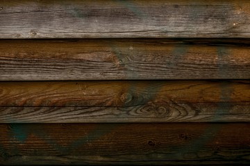 Shabby wooden logs texture. Old wood fence, barn surface. Hardwood weathered grunge oak wall. Dark old wooden planks. Close-up of dirty boards. Abandoned dark brown wood background. Abstract pattern.