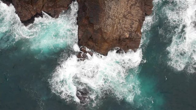 Aerial drone shot of rocky shore of Tung Lung Island in Hong Kong. Popular tourist destination in China. Waves crashing on the rocky beach coastline. Rock climbing destination. 