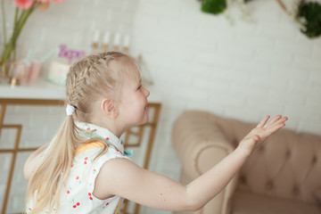 Fototapeta premium happy pretty little girl at birthday party, indoor