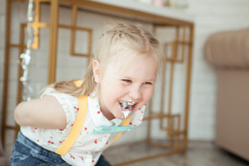 Fototapeta premium happy pretty little girl at birthday party, indoor