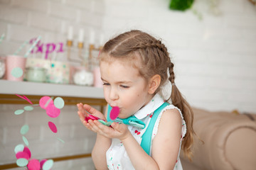 happy pretty little girl at birthday party, indoor