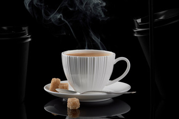 White cup of coffee and black paper cup for hot drinks on a black background. - 269507045
