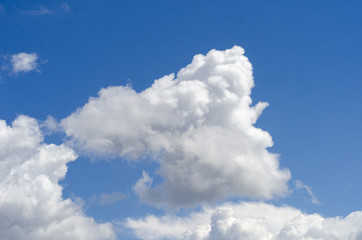 Naklejka na ściany i meble White big cloud on blue sky. Nature.