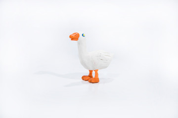 Plasticine artwork. Handmade camel. Abstract isolated photo.