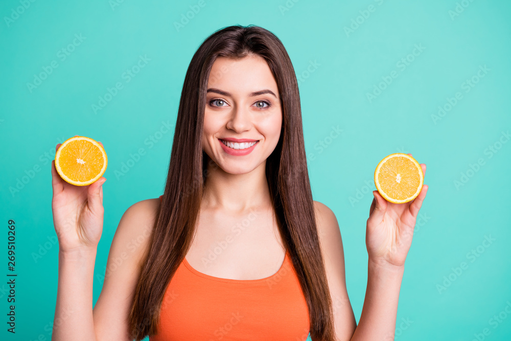 Wall mural Close up photo beautiful amazing her she lady hold arms two citrus useful slices products advertising nutrition freshness wear casual orange tank-top isolated bright teal turquoise background