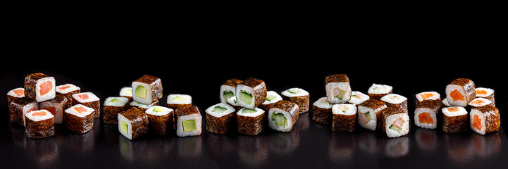 Classic sushi roll. Sushi at black background.Japanese seafood sushi , sushi a black background.