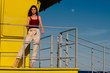 a young model with long hair in a summer scene
