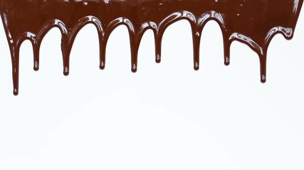 Melted chocolate syrup on white background.