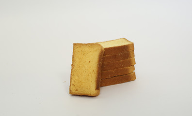 stack of cookies and rusk on white background