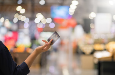 Close up hands holding cradit card