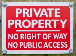 Private Property sign - white text on red background