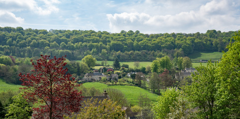 View across Sheepscombe with village church, St John the Apostle, The Cotswolds,United Kingdom