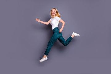 Full length body size view photo of charming positive childish dream dreamy lady have training free time laughter glad speed dressed sneakers fashionable clothing outfit isolated grey background