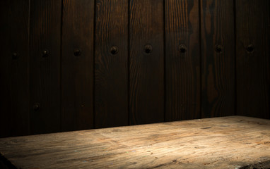 Selected focus empty brown wooden table and wall texture or old black brick wall blur background image. for your photomontage or product display