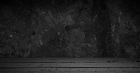 Old wooden table with brick background dark