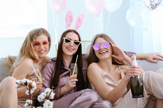 Beautiful young women drinking champagne at hen party